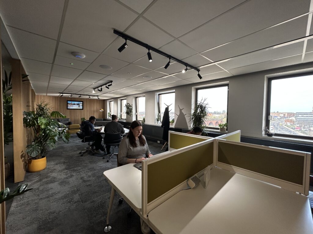 People working at a coworking space at Regent House in Stockport.