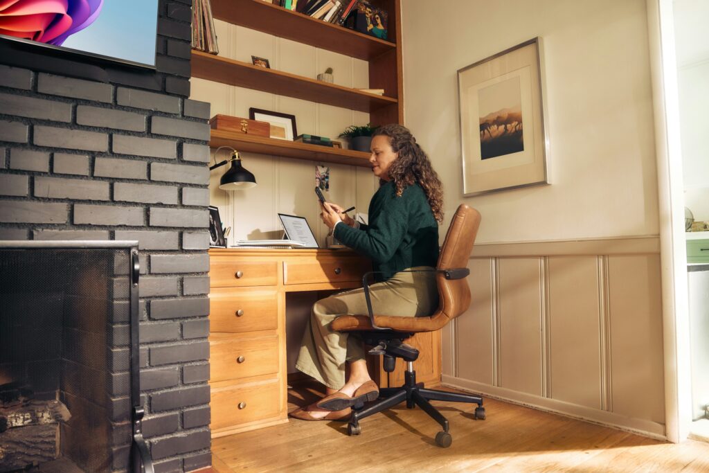 Woman working from home at a desk as part of a hybrid working setup